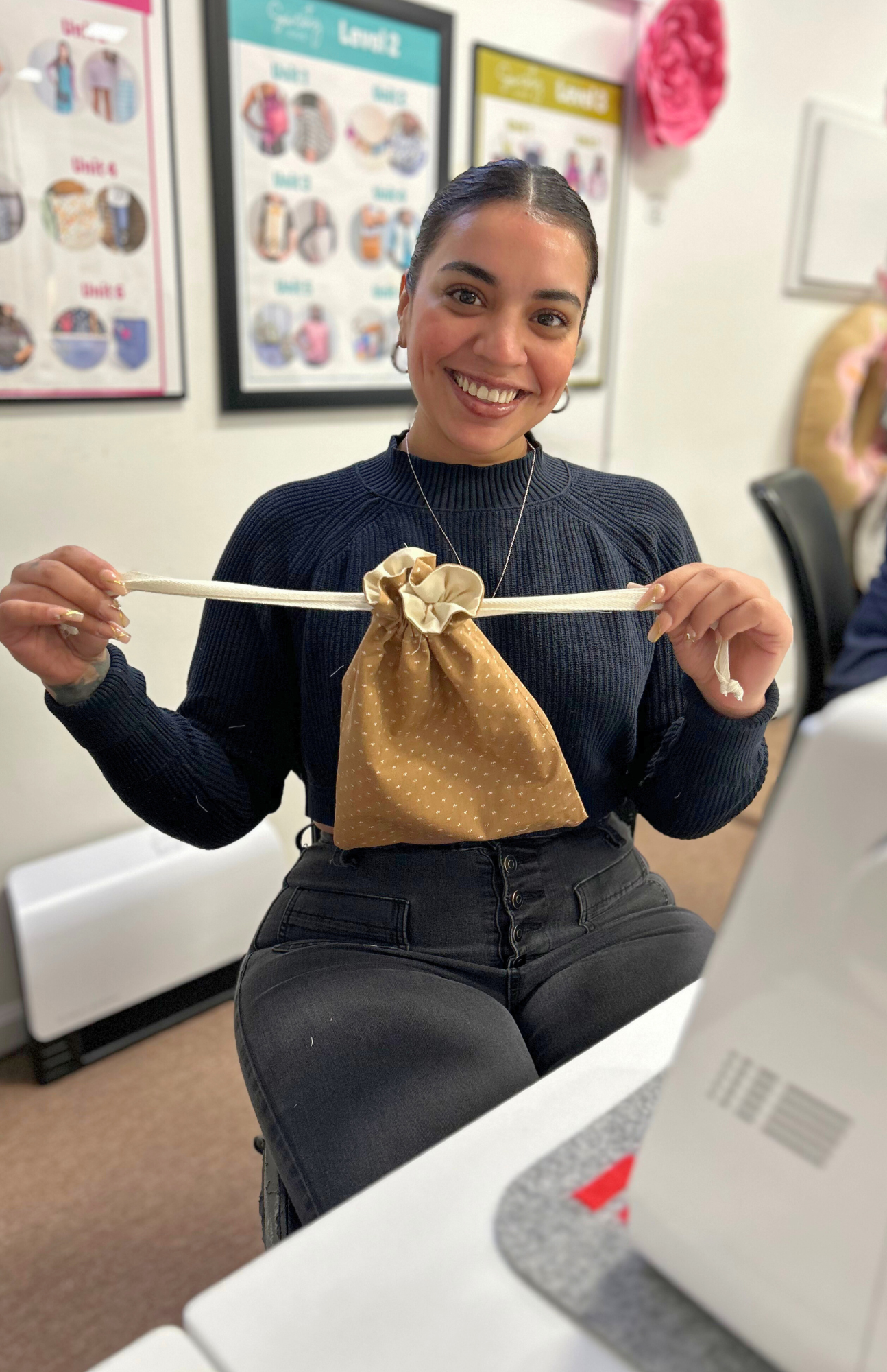 Student sewing her first project in Sewing 101 class